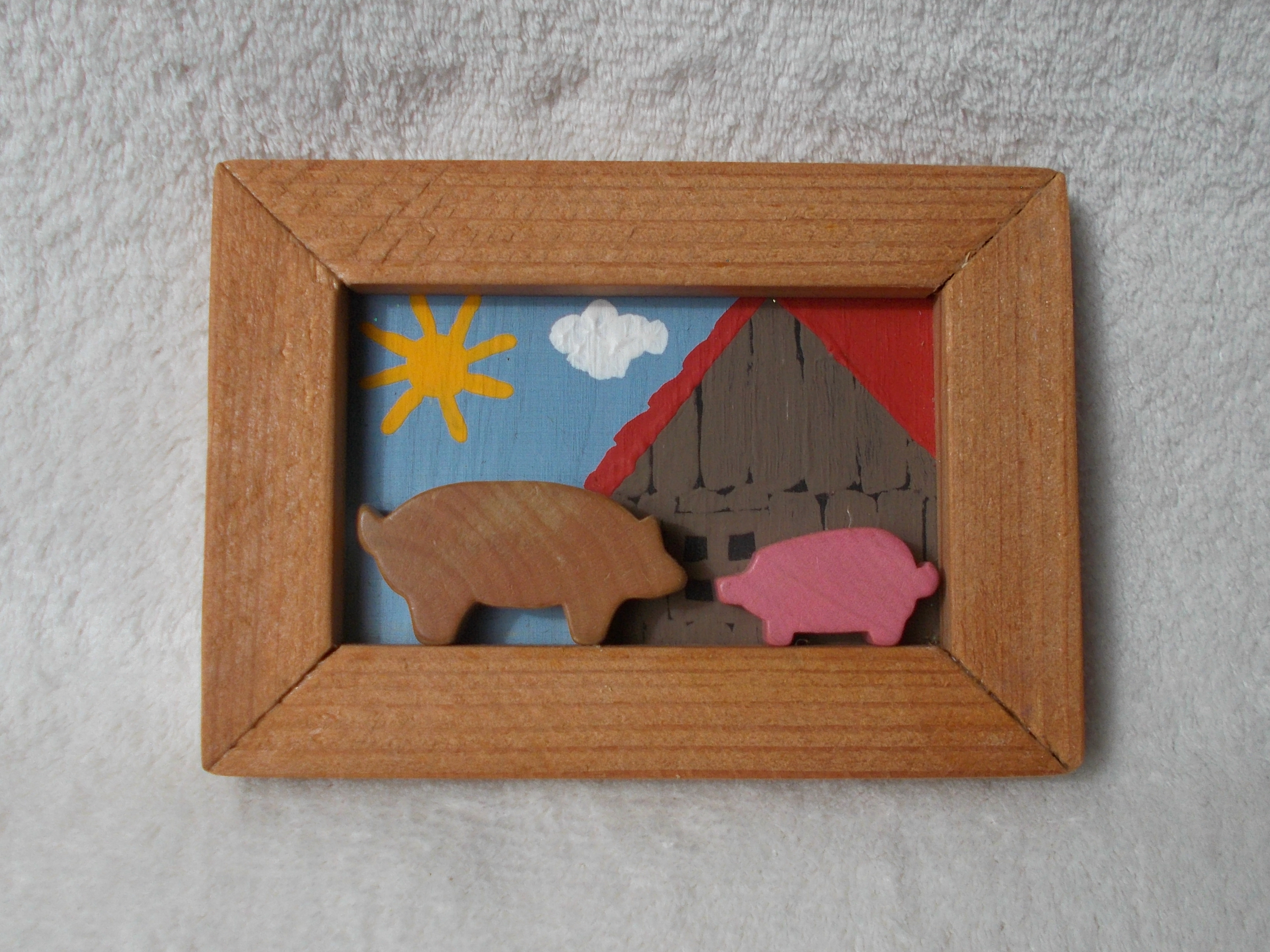 Holzreliefbild Schweine